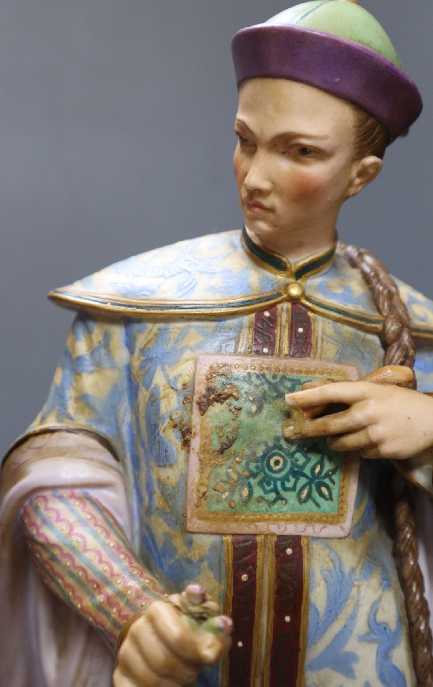 A pair of 19th century coloured bisque porcelain Oriental figures, height 38cm